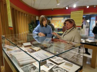 two women discussing the exhibit at A Woman's Place: Women and Work